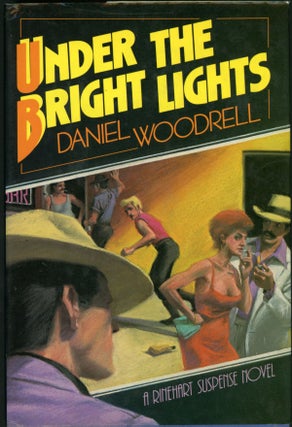 Item #22550 UNDER THE BRIGHT LIGHTS. Daniel Woodrell